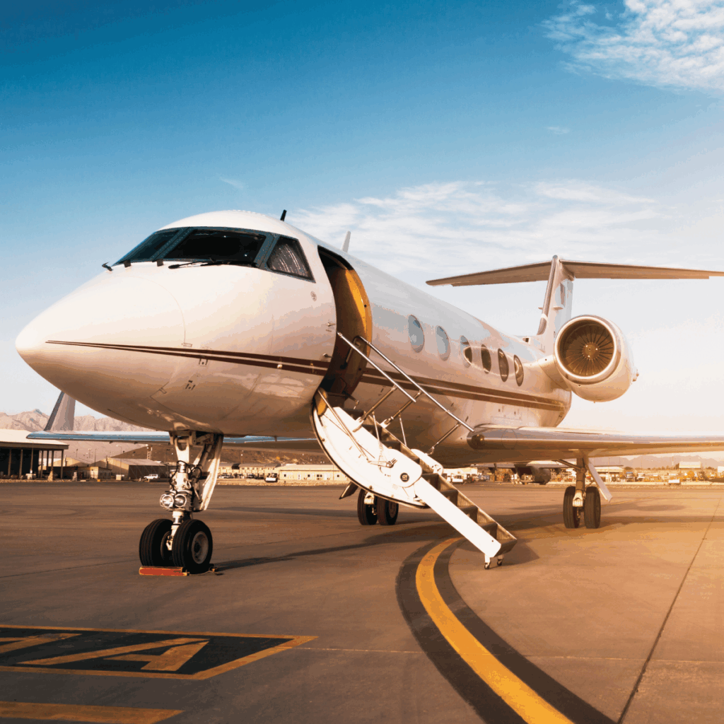 A private jet sitting on a runway with the door open and stairs lowered.